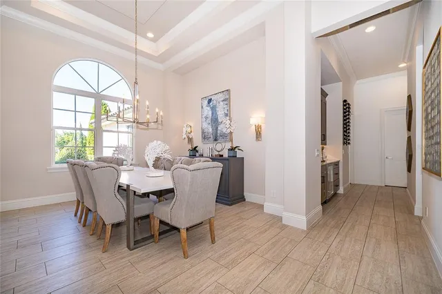 a large kitchen with stainless steel appliances kitchen island granite countertop a large counter top a stove a sink and a refrigerator