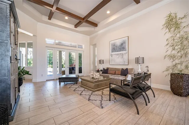 a kitchen with stainless steel appliances kitchen island granite countertop a stove a sink and a refrigerator