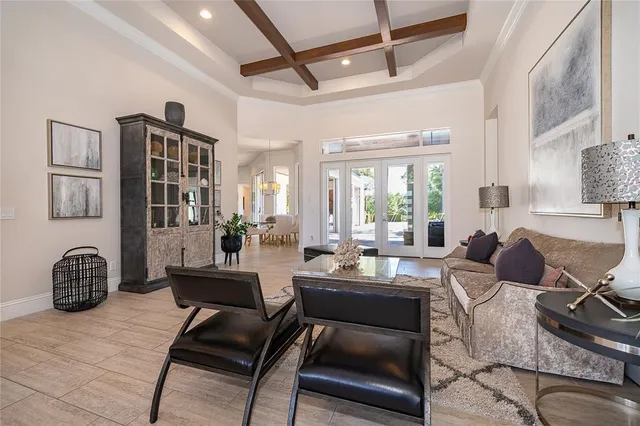 a kitchen with kitchen island granite countertop a sink a stove and a wooden floors