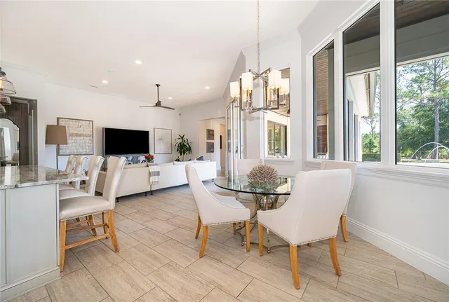 a spacious bedroom with a bed couch and window