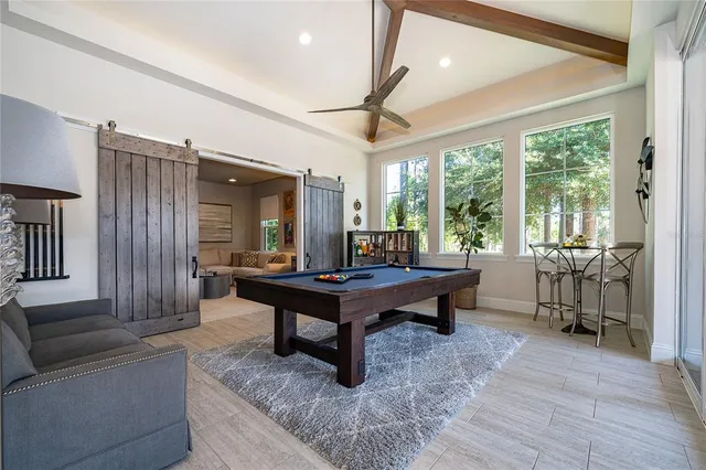 a kitchen with a refrigerator and a stove