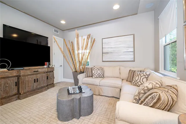 a outdoor space with the couches and dining table with the garden view