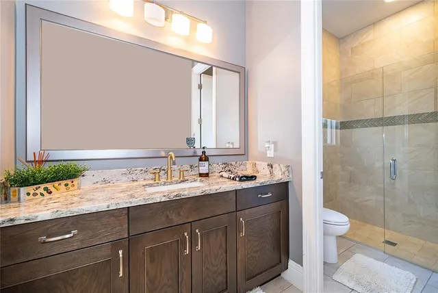 an aerial view of multiple houses with yard