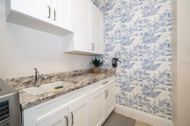 an aerial view of a residential houses with outdoor space