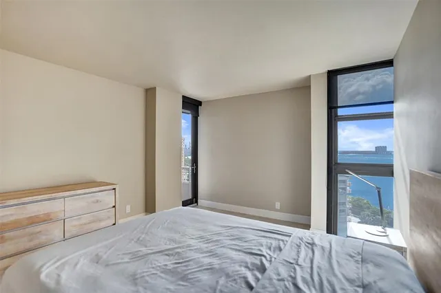 a view of a hallway with workspace and a window