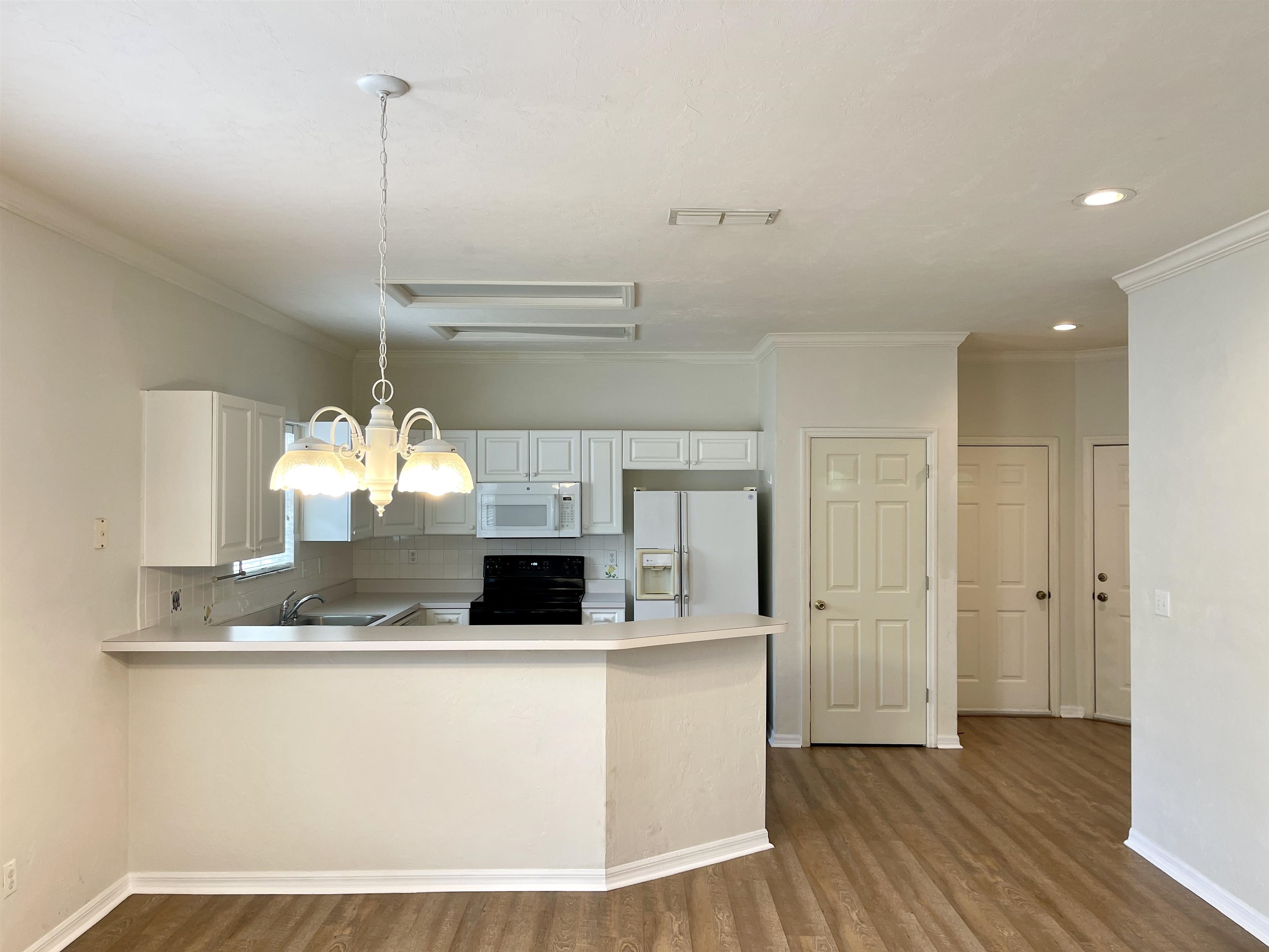 4841 Northwest 75th Road Gainesville, FL 32653 - Photo 3 of 25 a view wooden floor with kitchen view