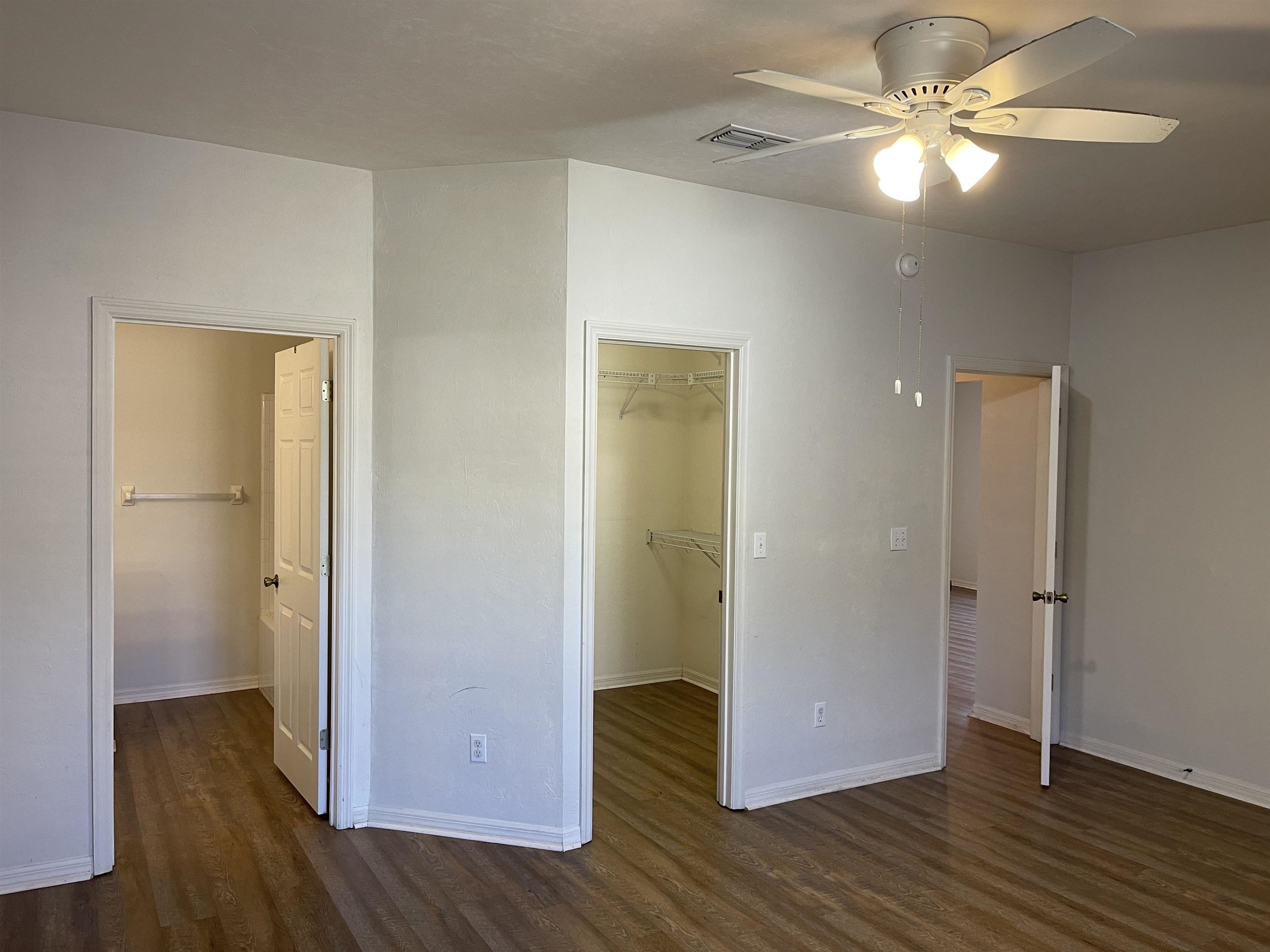4841 Northwest 75th Road Gainesville, FL 32653 - Photo 8 of 25 a view of an empty room with wooden floor