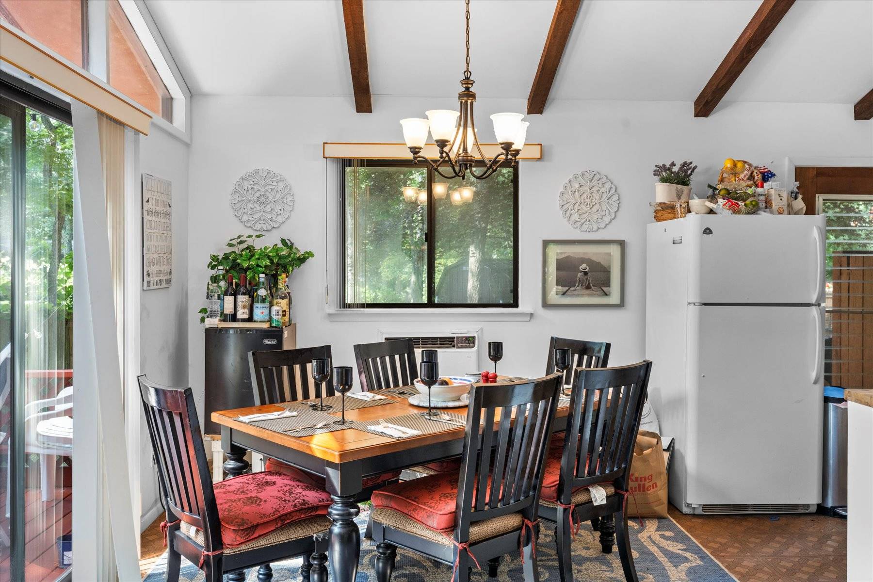 63 Harbor Avenue Sag Harbor, NY 11963 - Photo 5 of 18 a dining room with furniture a livingroom and chandelier