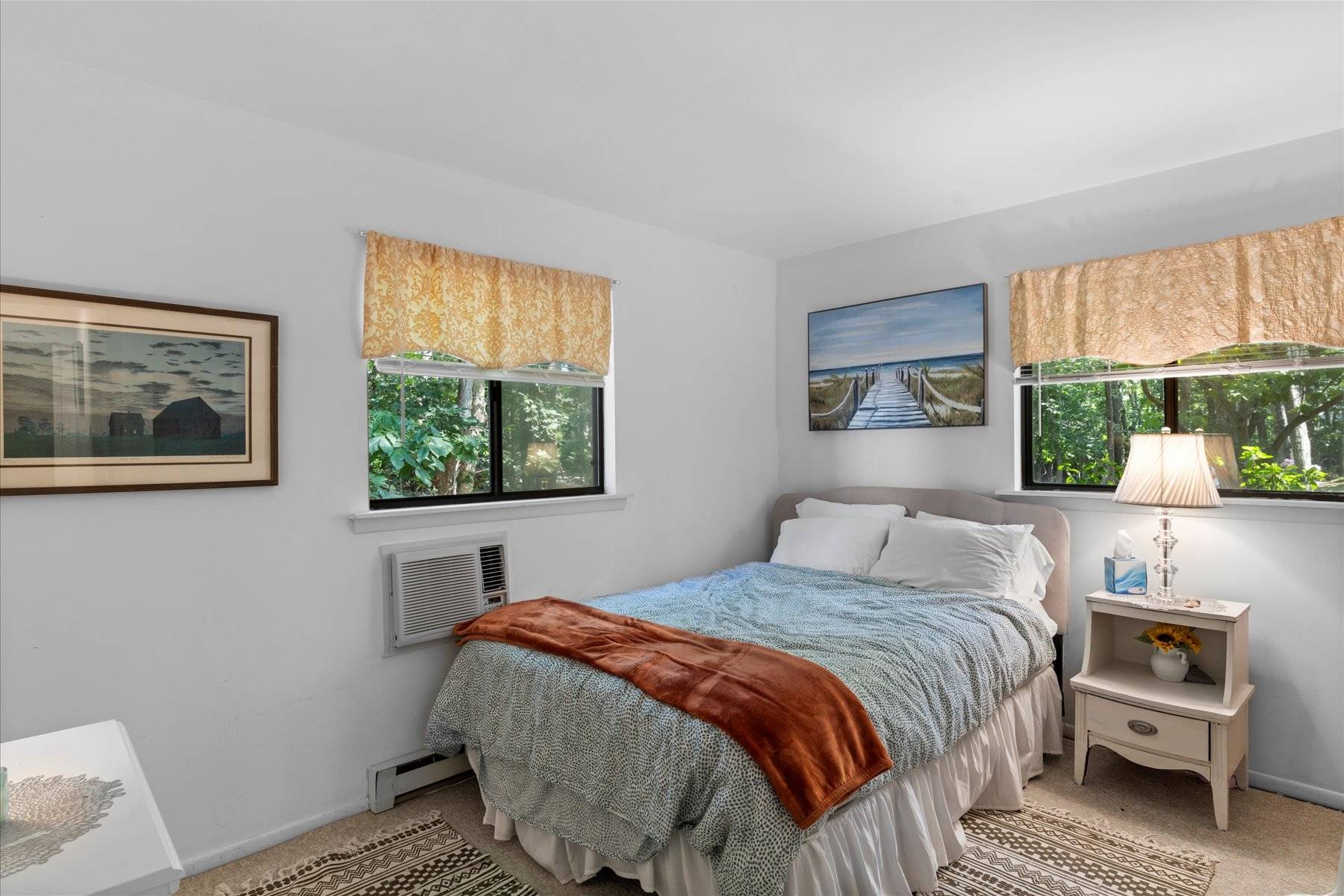 63 Harbor Avenue Sag Harbor, NY 11963 - Photo 7 of 18 a bedroom with a bed and a window