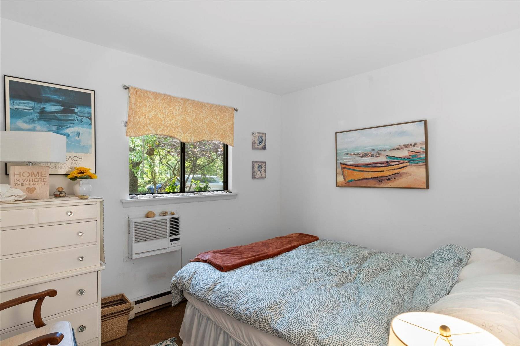 63 Harbor Avenue Sag Harbor, NY 11963 - Photo 9 of 18 a bedroom with a bed and a window