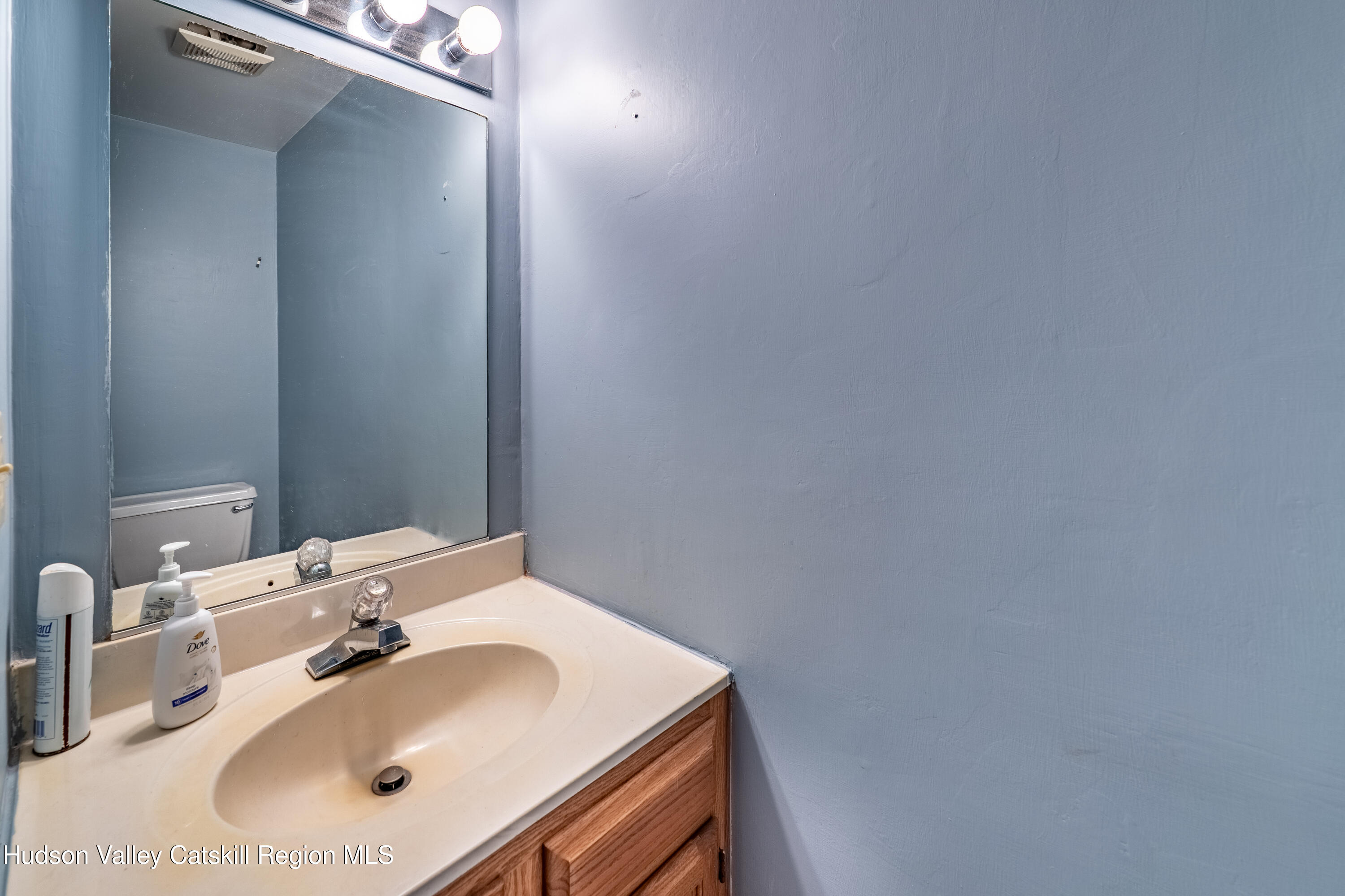 32 Red Maple Road Saugerties, NY 12477 - Photo 12 of 26 a bathroom with a sink and a mirror