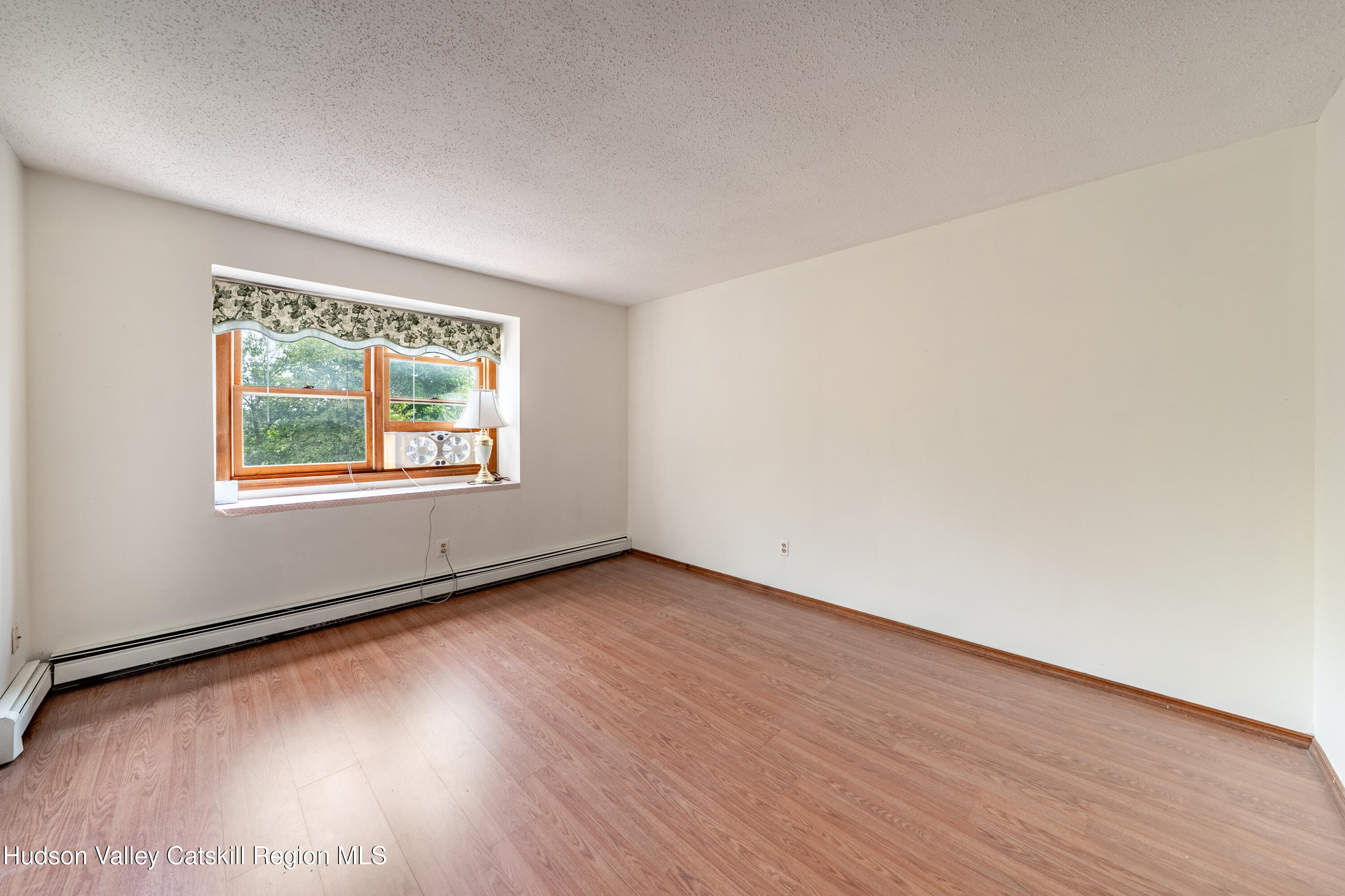 32 Red Maple Road Saugerties, NY 12477 - Photo 20 of 26 an empty room with wooden floor and windows