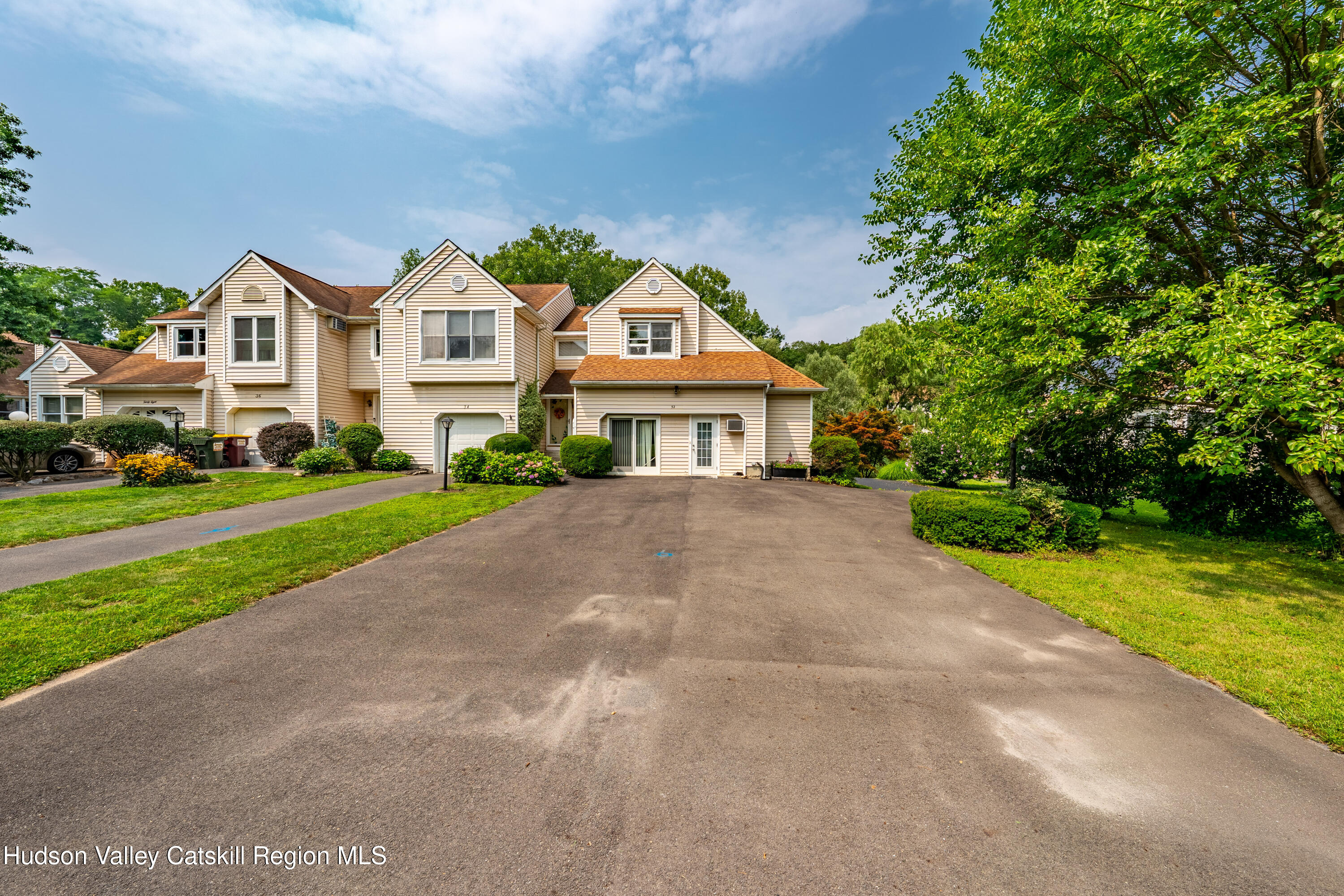 32 Red Maple Road Saugerties, NY 12477 - Photo 2 of 26 a view of multiple houses with a yard