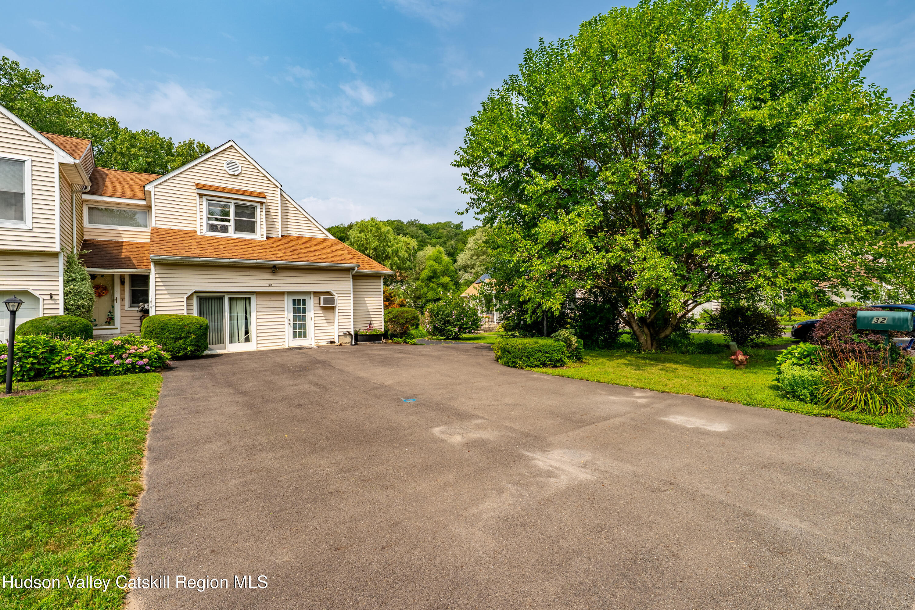 32 Red Maple Road Saugerties, NY 12477 - Photo 5 of 26 a front view of house with yard and trees in the background