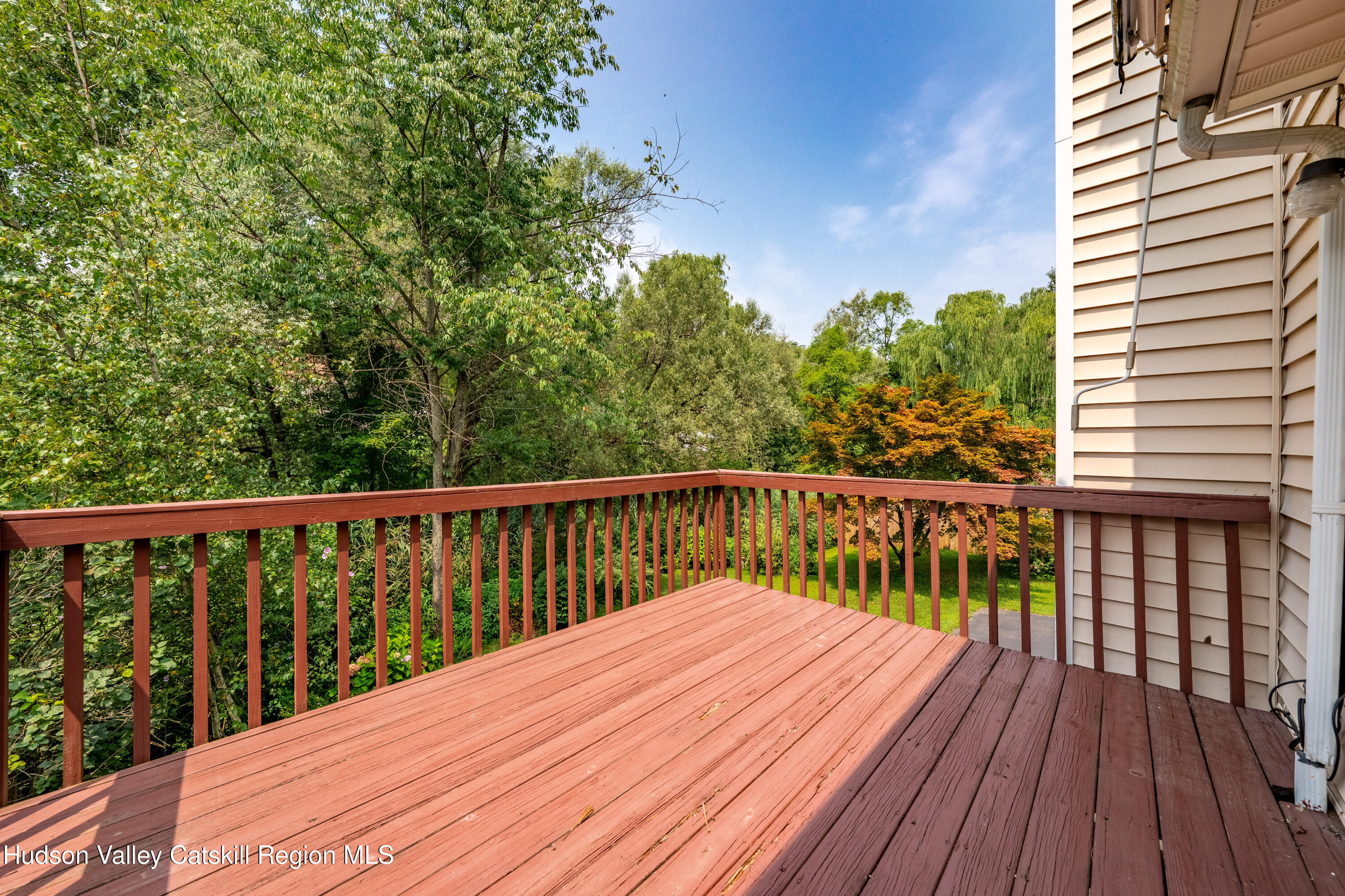 32 Red Maple Road Saugerties, NY 12477 - Photo 8 of 26 a balcony with wooden floor and fence