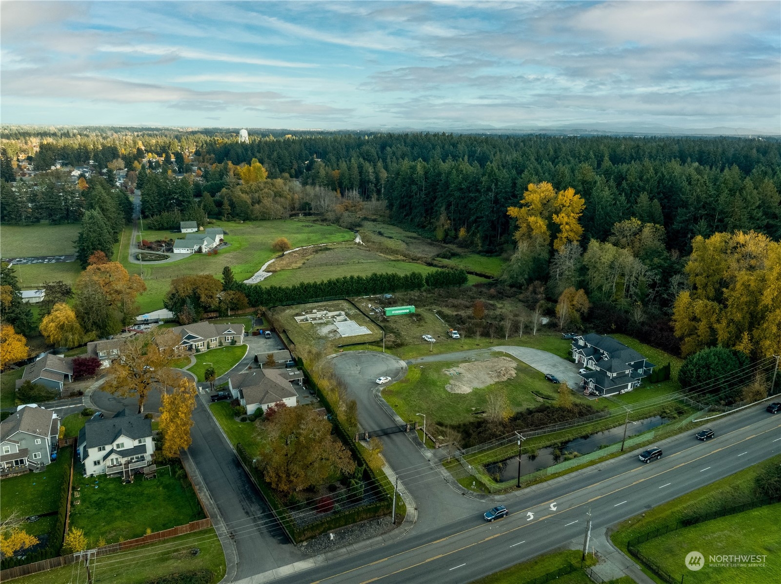 an aerial view of a golf course with parking space