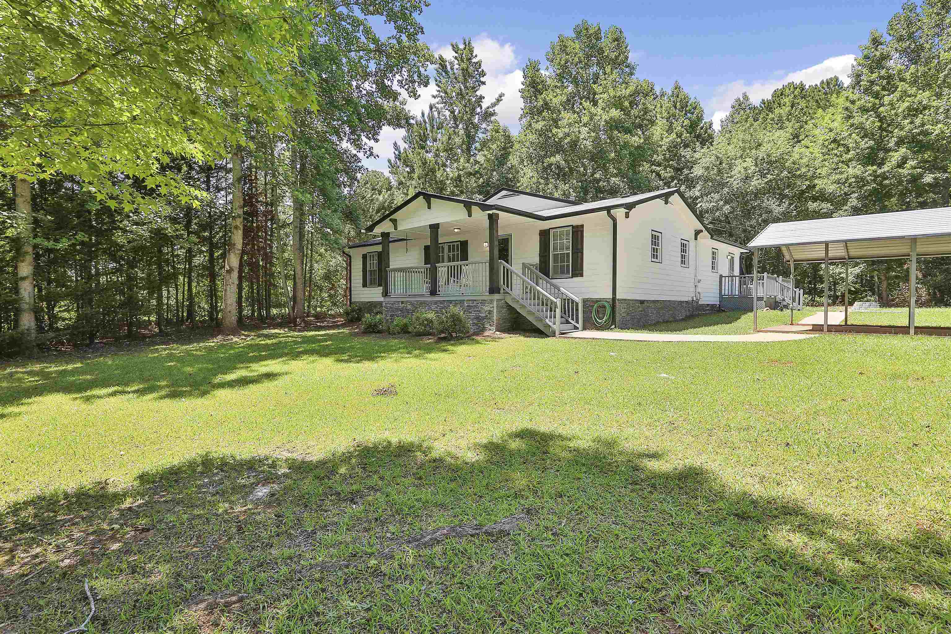 3497 Corinth Road Newnan, GA 30263 - Photo 1 of 1 a view of a house with a yard