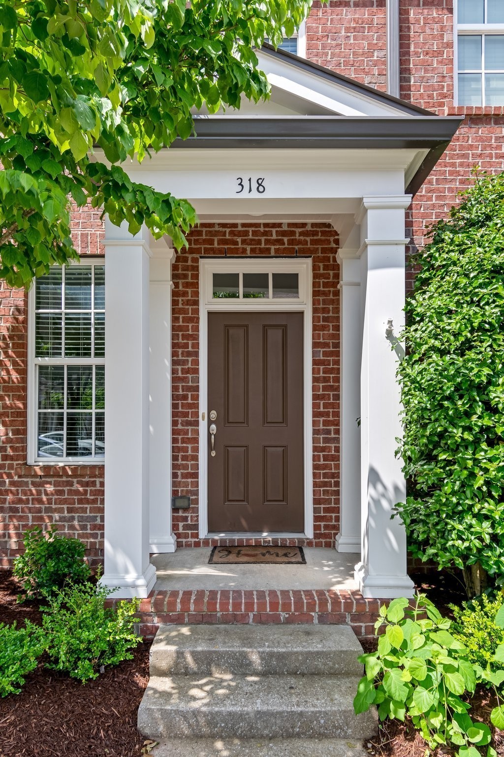 318 Byron Way Franklin, TN 37064 - Photo 4 of 53 a front view of a house with plants