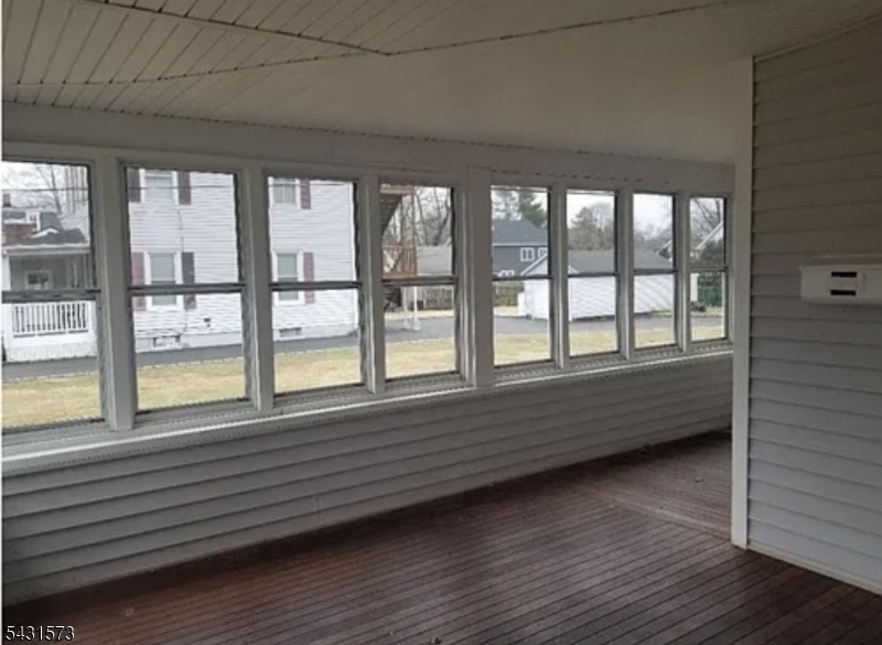 358 Woodland Road, Unit 2 Madison, NJ 07940 - Photo 33 of 50 a view of empty room with wooden floor and fan