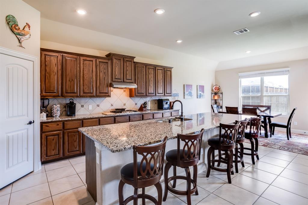 248 Georgetown Drive Forney, TX 75126 - Photo 11 of 39 a view of a dining room with furniture