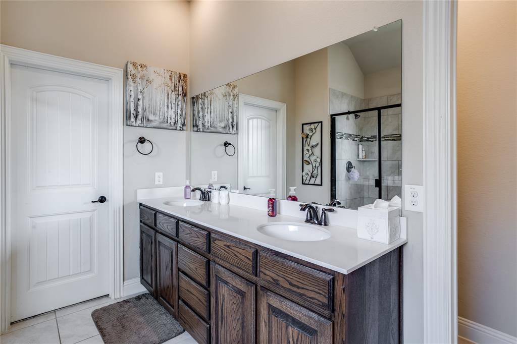 248 Georgetown Drive Forney, TX 75126 - Photo 17 of 39 a bathroom with a sink and a mirror