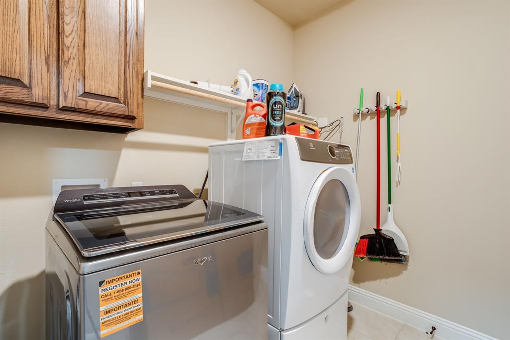 248 Georgetown Drive Forney, TX 75126 - Photo 22 of 39 a utility room with dryer and washer