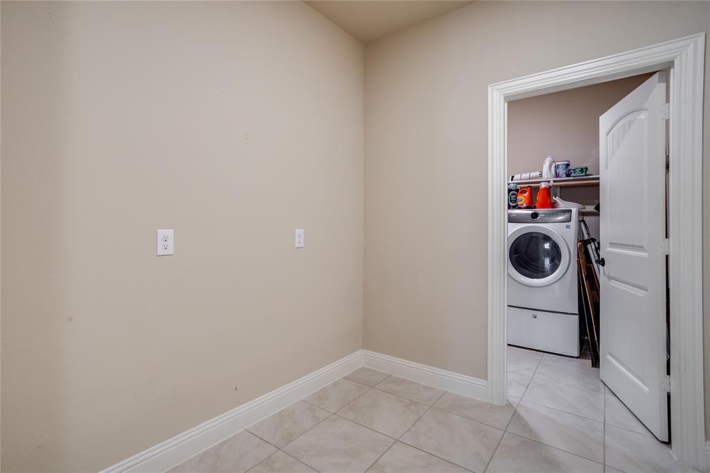 248 Georgetown Drive Forney, TX 75126 - Photo 23 of 39 a utility room with dryer and washer
