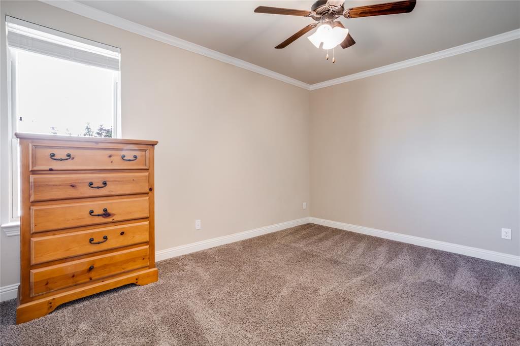 248 Georgetown Drive Forney, TX 75126 - Photo 29 of 39 a view of an empty room with a ceiling fan and a window