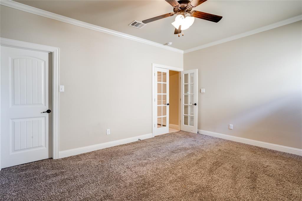 248 Georgetown Drive Forney, TX 75126 - Photo 30 of 39 a view of an empty room with a ceiling fan