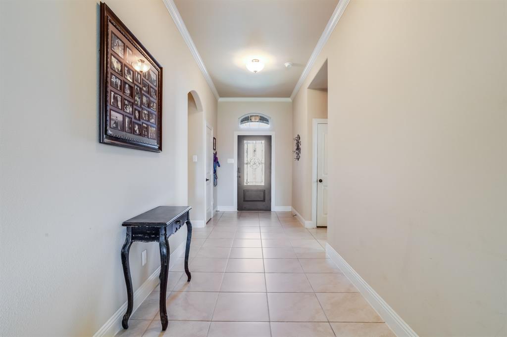 248 Georgetown Drive Forney, TX 75126 - Photo 3 of 39 a view of a hallway with entryway