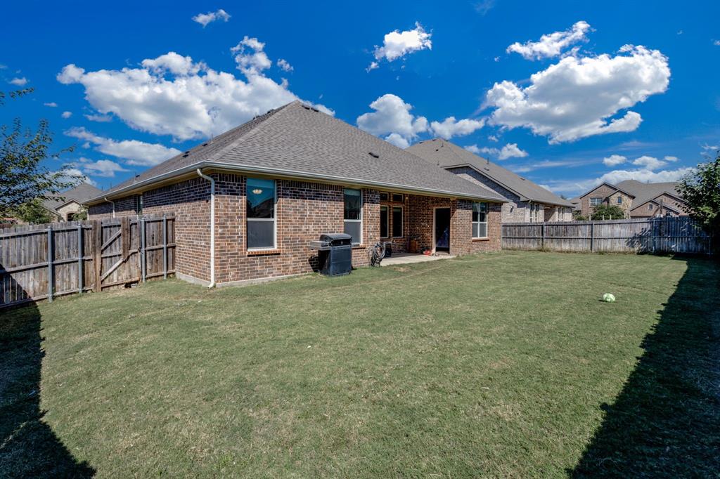 248 Georgetown Drive Forney, TX 75126 - Photo 34 of 39 a view of a house with a backyard