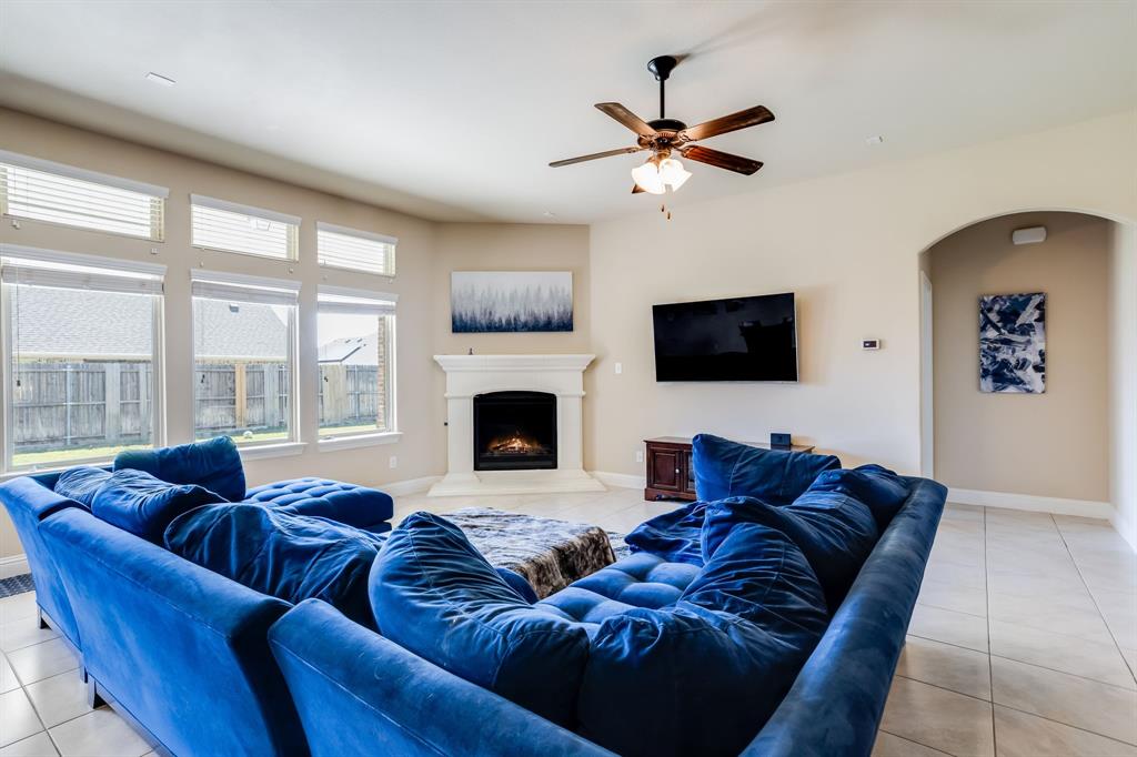 248 Georgetown Drive Forney, TX 75126 - Photo 5 of 39 a living room with furniture fireplace and flat screen tv