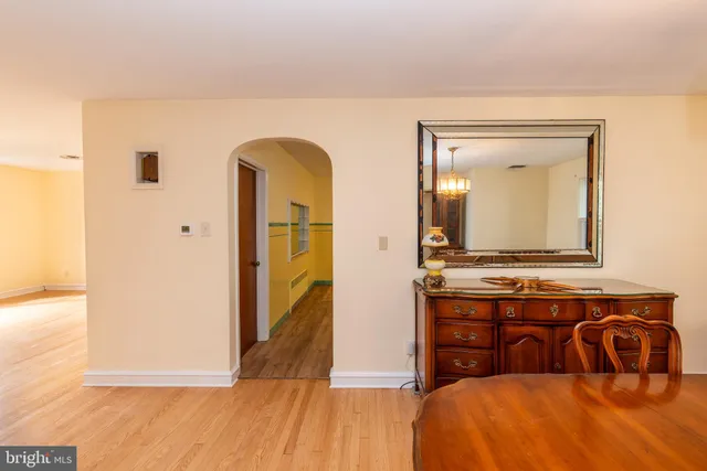 a bedroom with a bed and a mirror