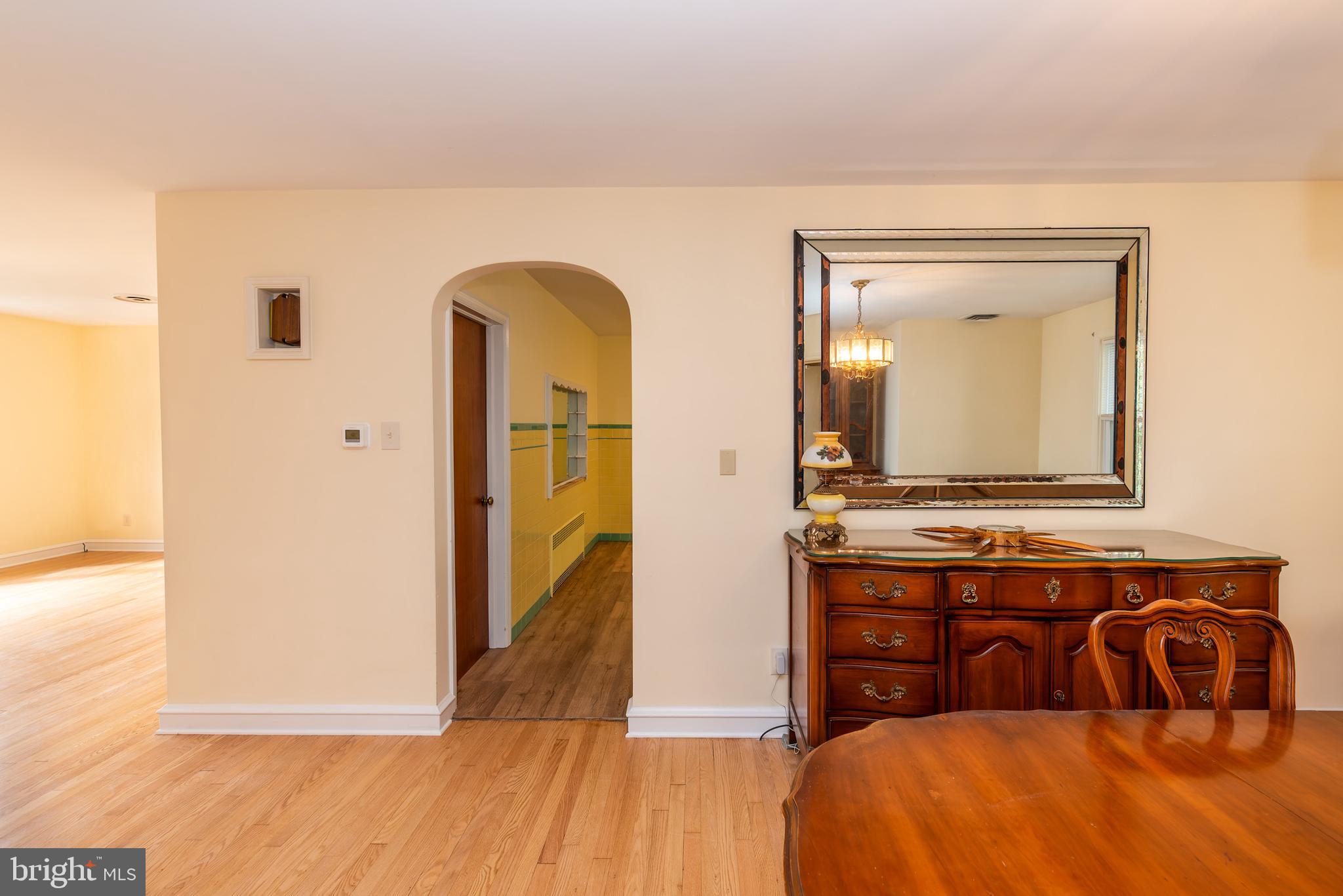 27 South State Street Vineland, NJ 08360 - Photo 18 of 46 a bedroom with a bed and a mirror