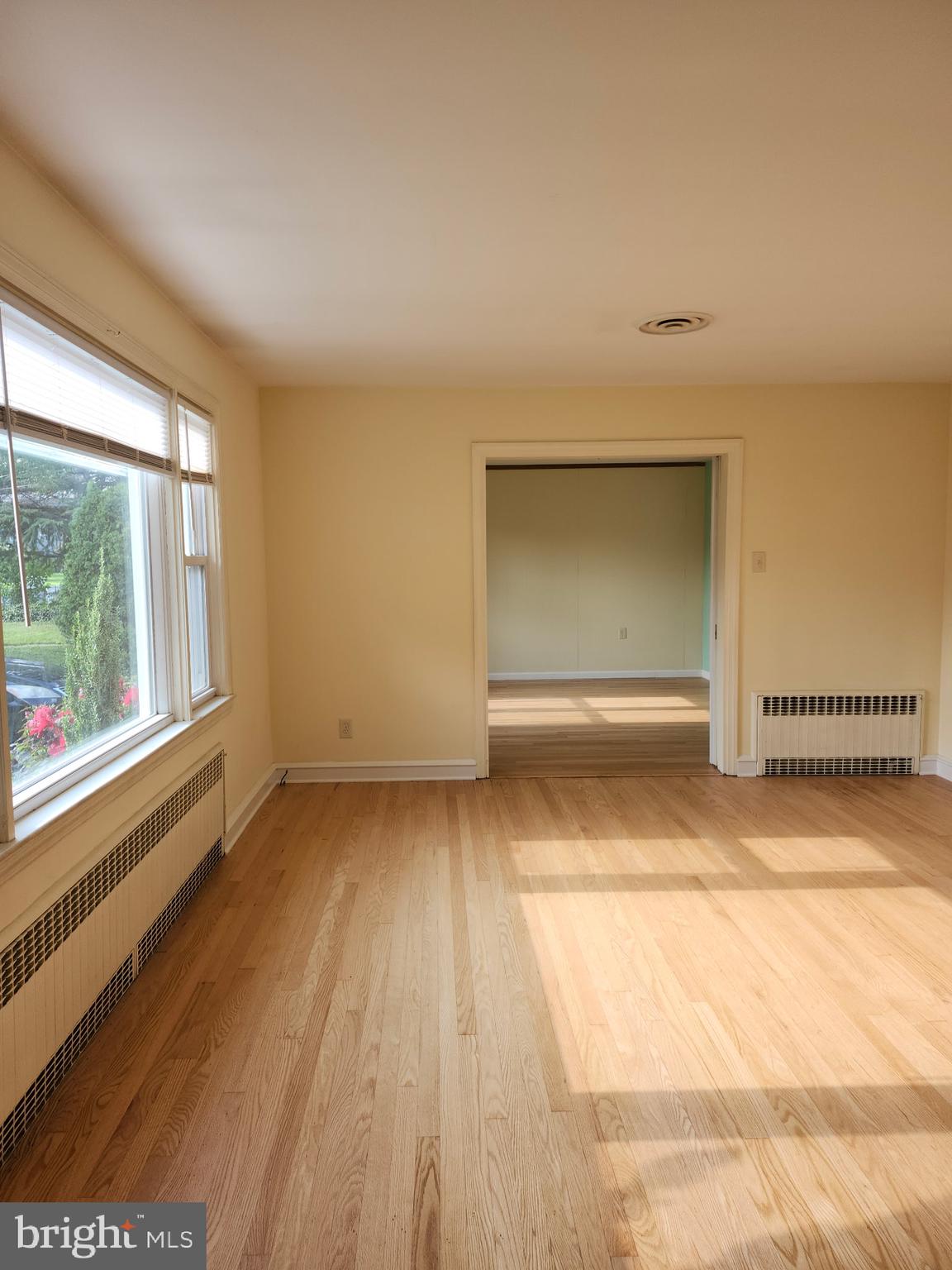 27 South State Street Vineland, NJ 08360 - Photo 20 of 46 a view of empty room with wooden floor and fan