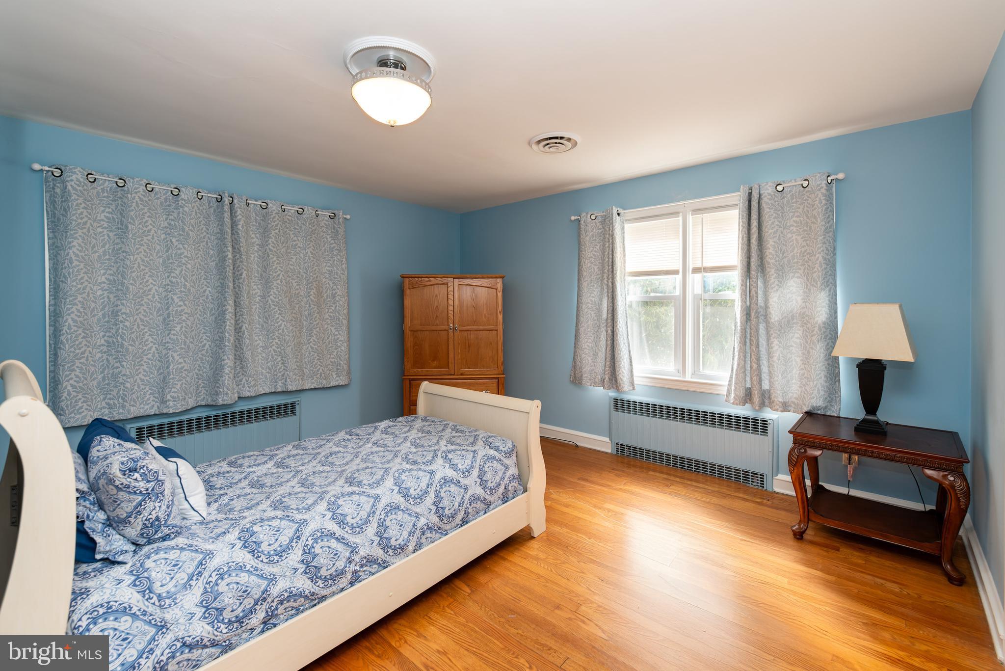 27 South State Street Vineland, NJ 08360 - Photo 24 of 46 a bedroom with a bed and wooden floor