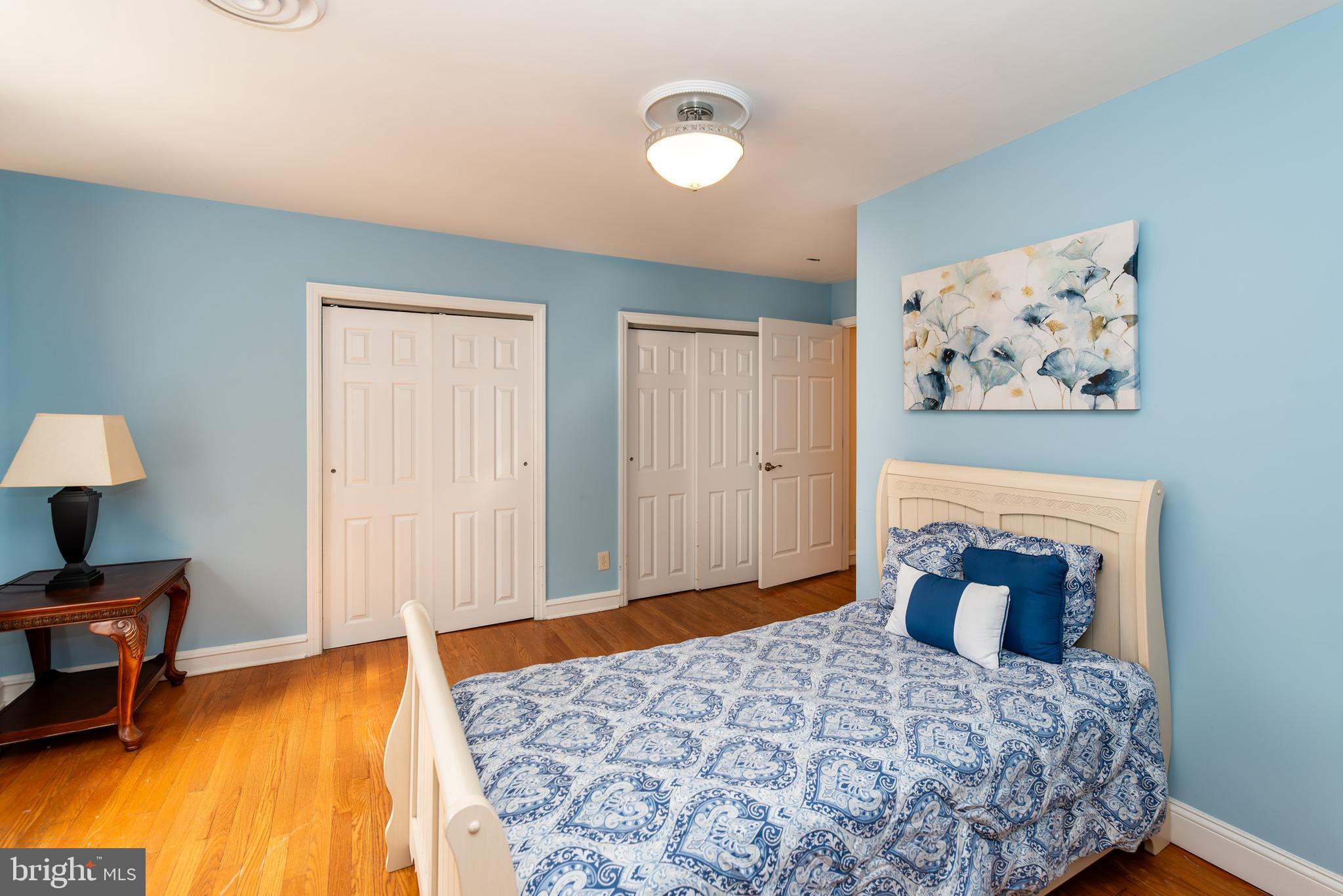 27 South State Street Vineland, NJ 08360 - Photo 25 of 46 a bedroom with a bed and a lamp on table