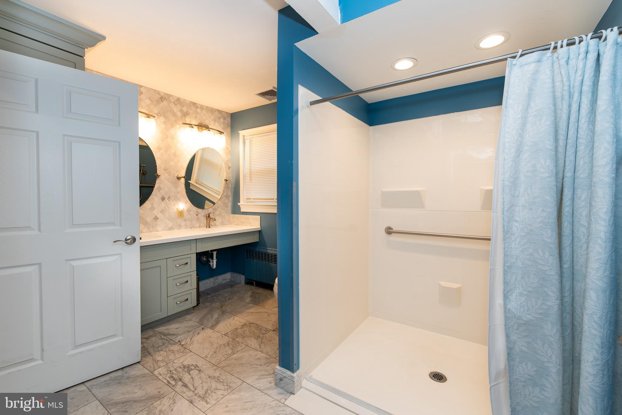 27 South State Street Vineland, NJ 08360 - Photo 27 of 46 a bathroom with a sink and a mirror