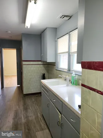 a kitchen with a sink and a window