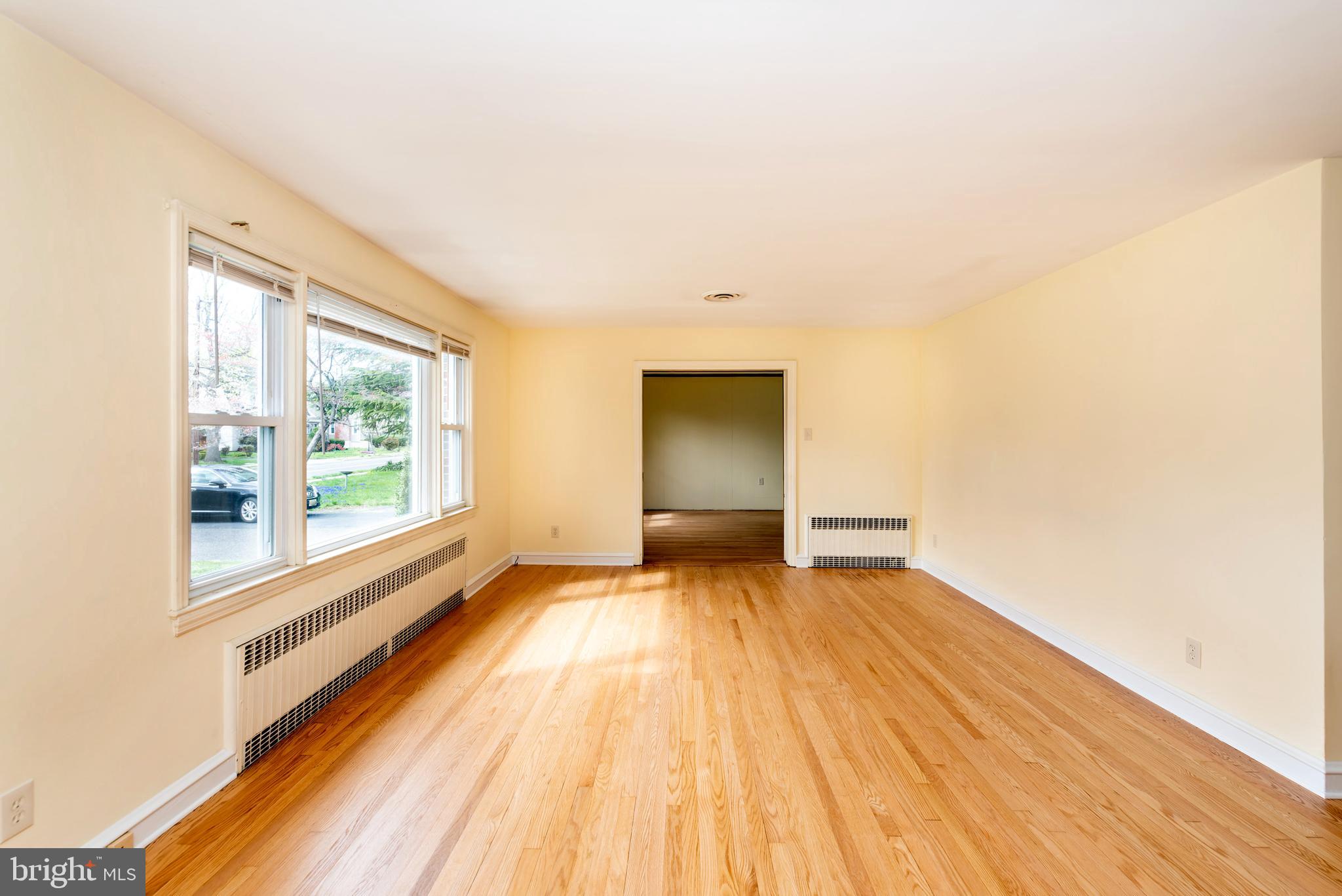 27 South State Street Vineland, NJ 08360 - Photo 8 of 46 a view of empty room with wooden floor and fan