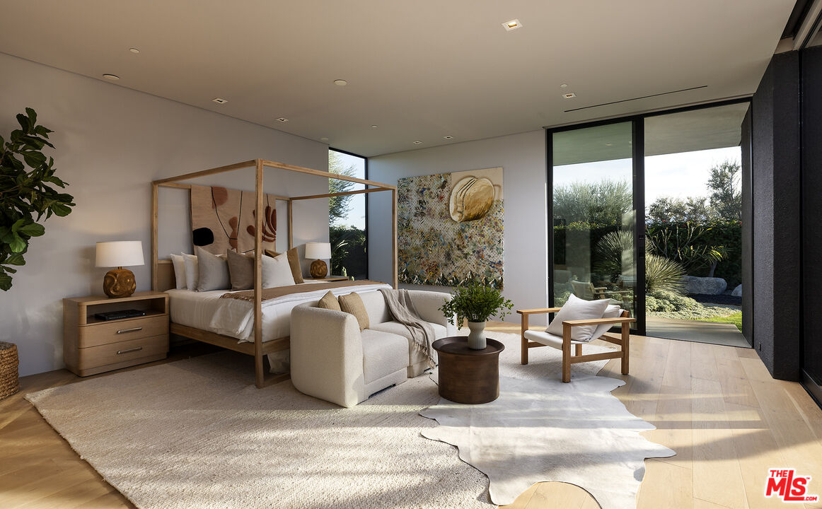 2 Echo Lane Rancho Mirage, CA 92270 - Photo 14 of 37 a living room with furniture large window and potted plants