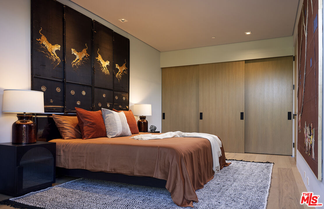 2 Echo Lane Rancho Mirage, CA 92270 - Photo 20 of 37 a bedroom with a bed and a painting on the wall