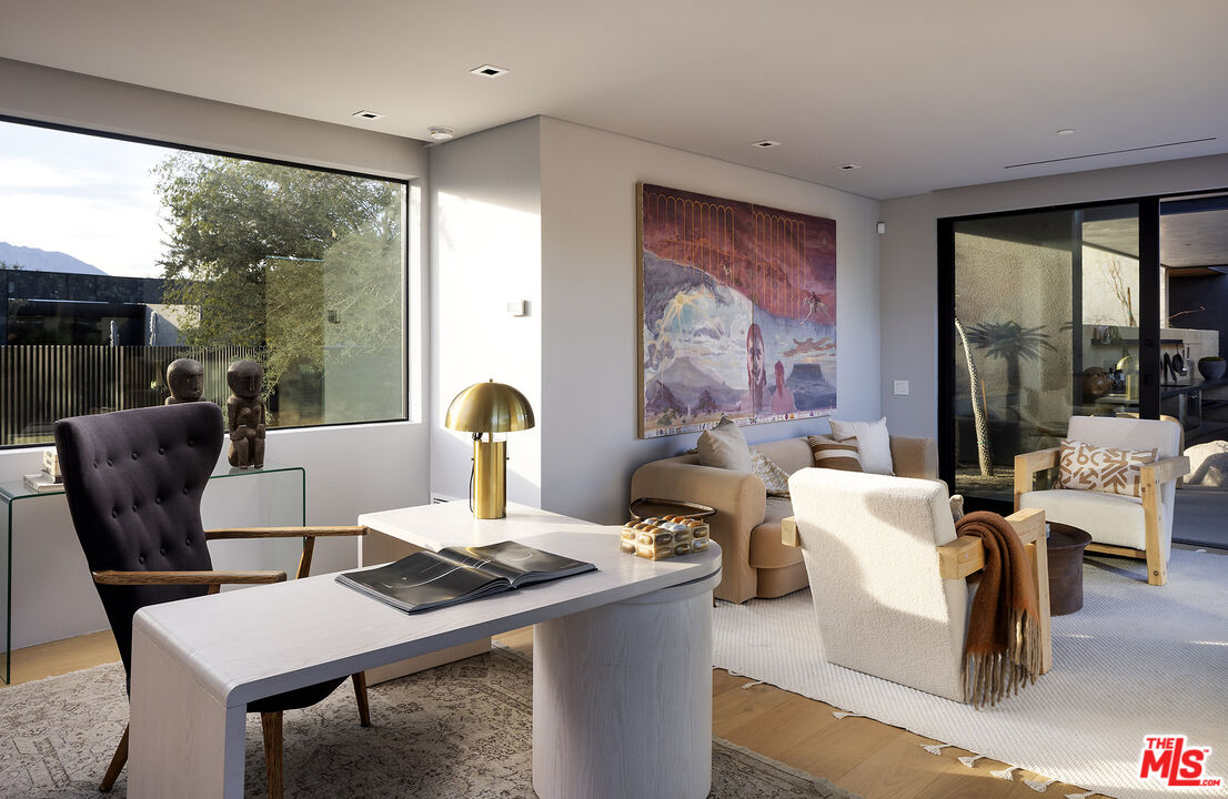 2 Echo Lane Rancho Mirage, CA 92270 - Photo 26 of 37 a living room with furniture a large window and a table