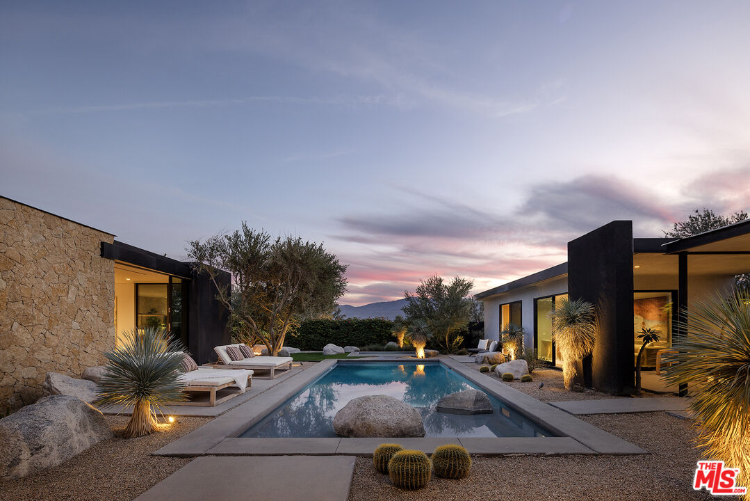 2 Echo Lane Rancho Mirage, CA 92270 - Photo 32 of 37 a view of a patio with swimming pool table and chairs