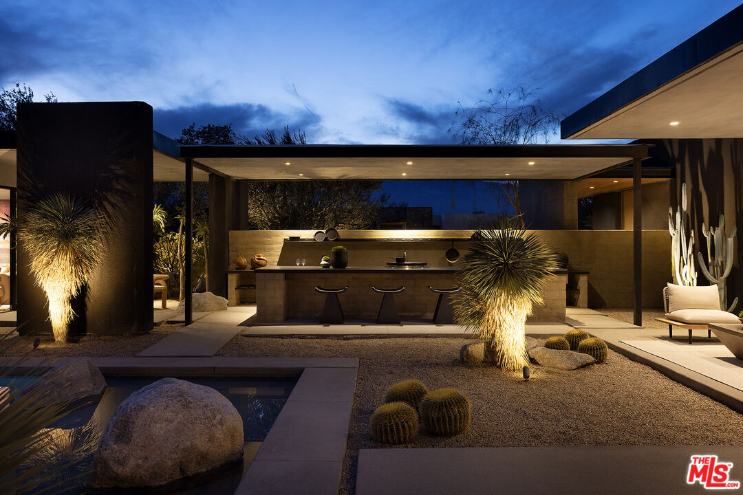 2 Echo Lane Rancho Mirage, CA 92270 - Photo 35 of 37 a living room with furniture and a fireplace