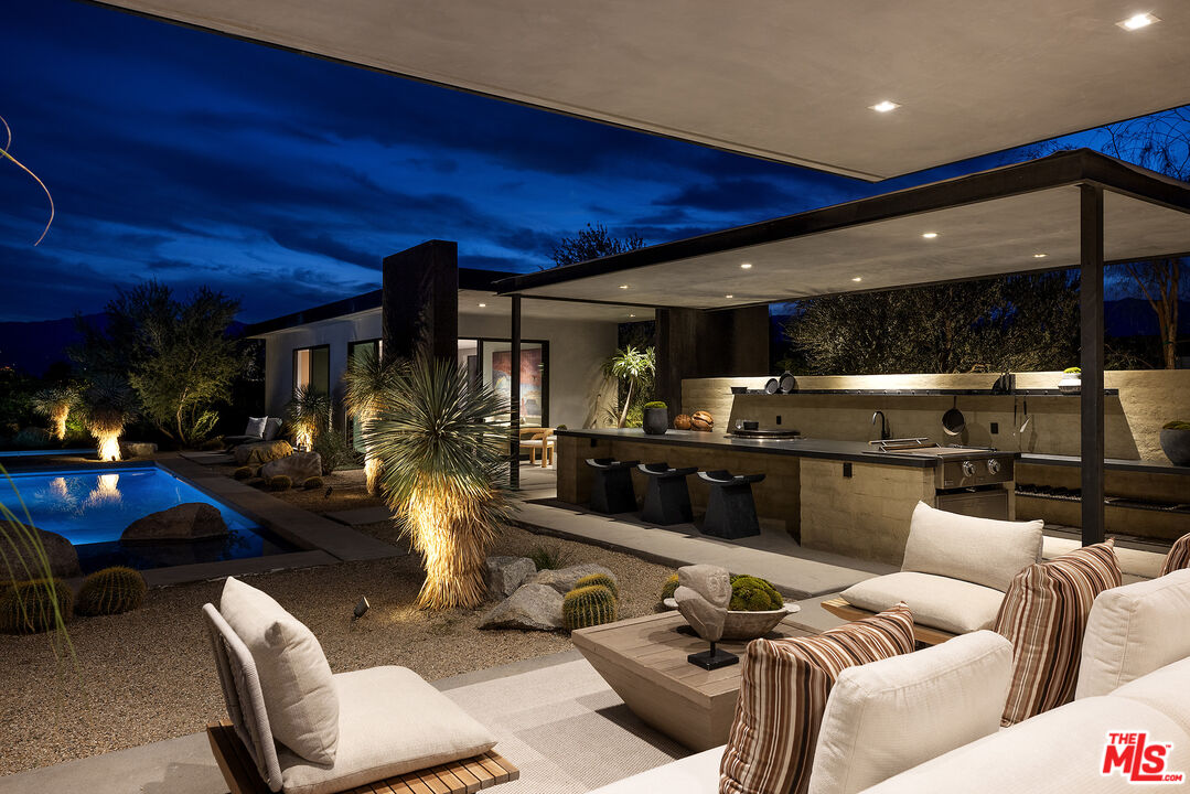 2 Echo Lane Rancho Mirage, CA 92270 - Photo 37 of 37 a living room with furniture a rug and kitchen view