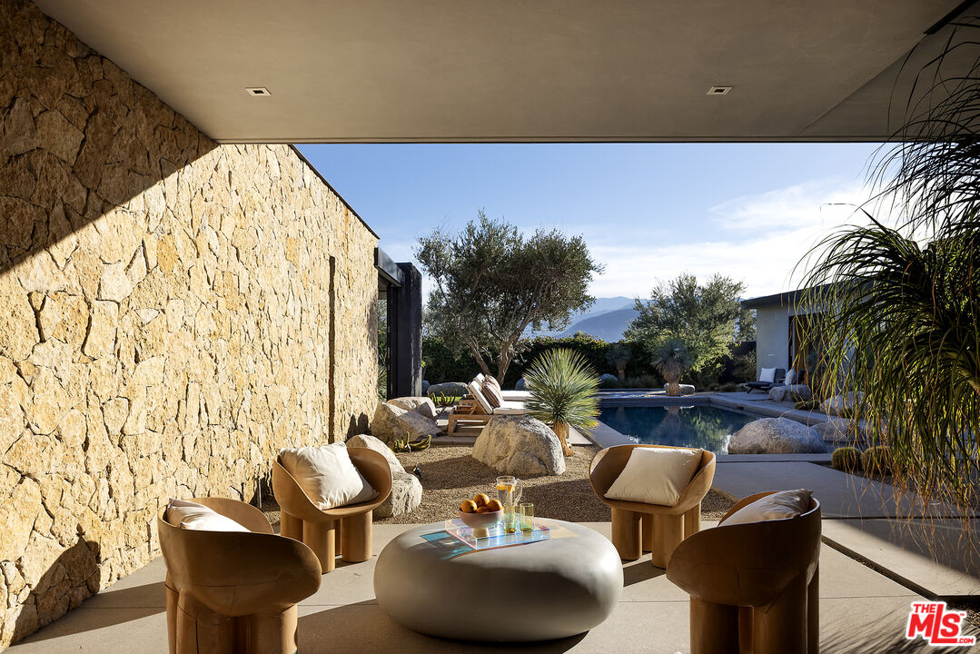 2 Echo Lane Rancho Mirage, CA 92270 - Photo 7 of 37 a outdoor living space with furniture and garden view