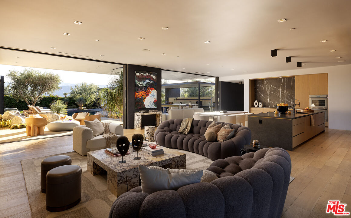 2 Echo Lane Rancho Mirage, CA 92270 - Photo 8 of 37 a living room with furniture and a large window