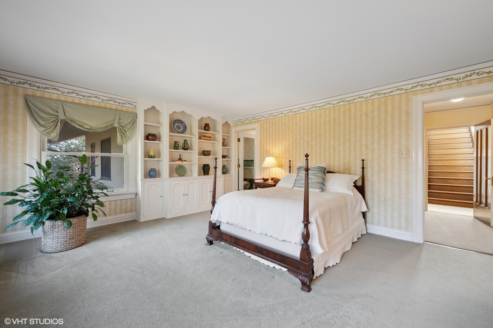 881 Private Road Winnetka, IL 60093 - Photo 35 of 60 a spacious bedroom with a bed lamp and potted plant