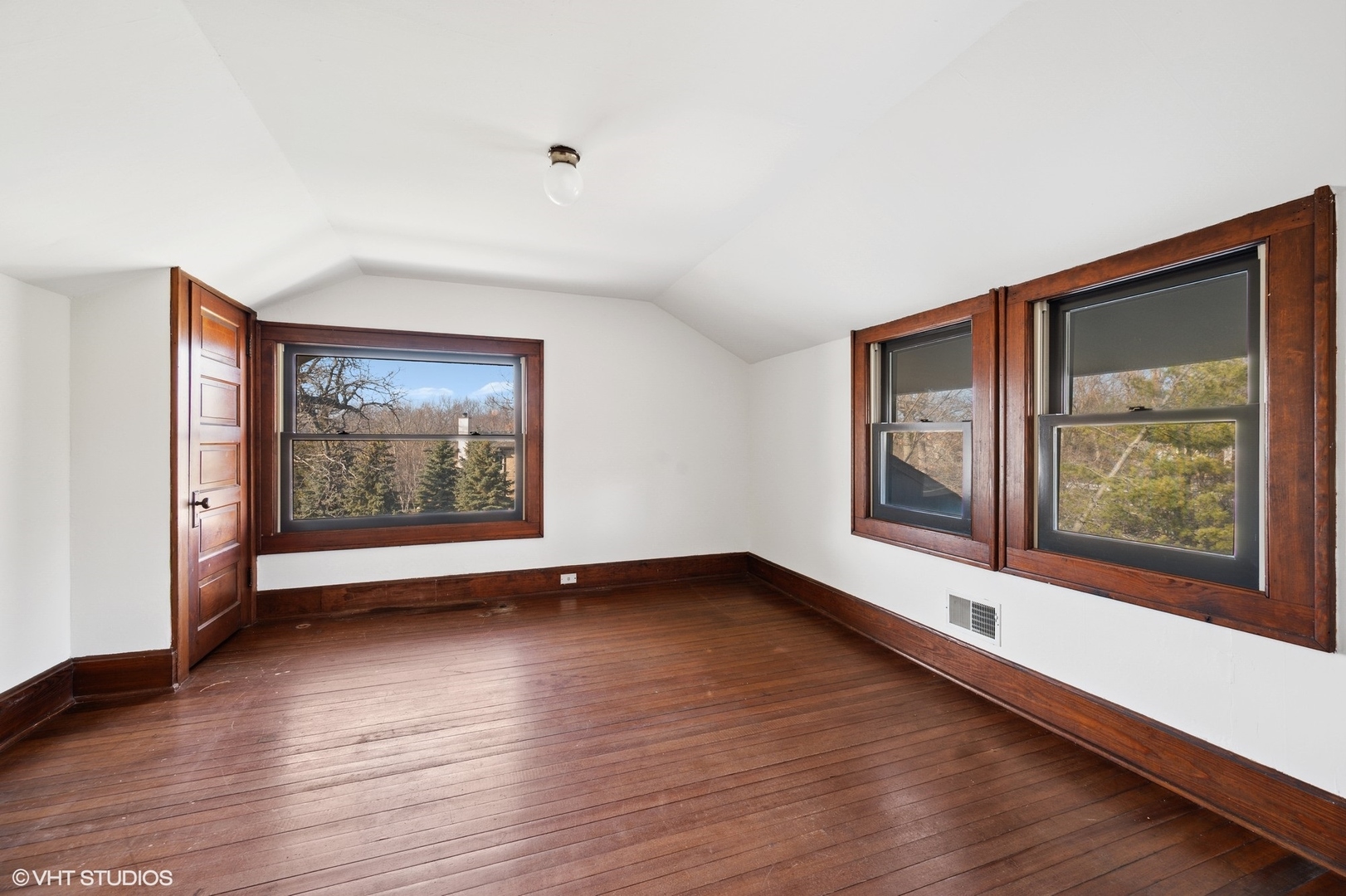 881 Private Road Winnetka, IL 60093 - Photo 45 of 60 a view of an empty room with a window and wooden floor